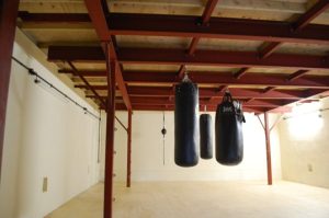 Punching bags hanging from the steel structure AJN supplied steel for at the Eastgate Boxing Club