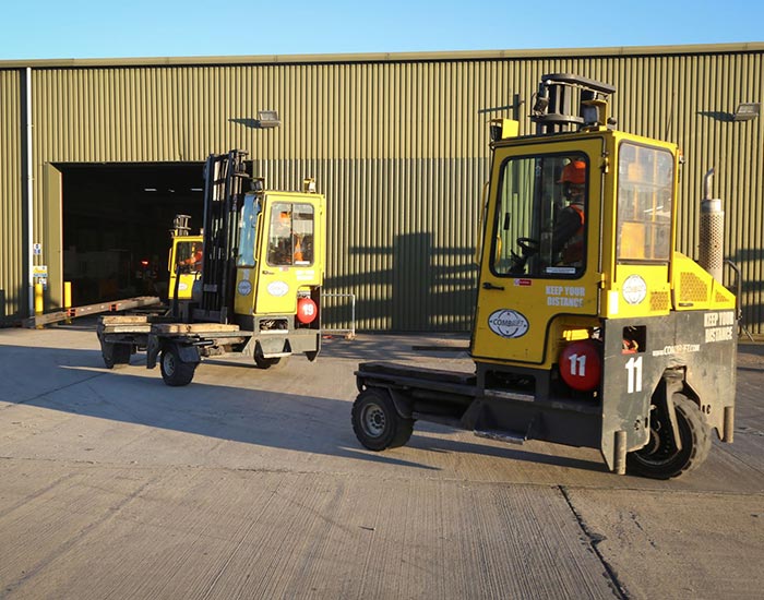 Sandra - AJN Two CombiLifts sitting at the AJN Steelstock Henstridge site, ready to pick up steel, shining in the sun