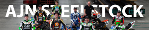 A group of superbike and speedway riders looking up at a camera, similing for a photosoot with the text AJN Steelstock behind them