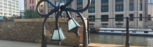 A twisted steel lamppost in an urban area